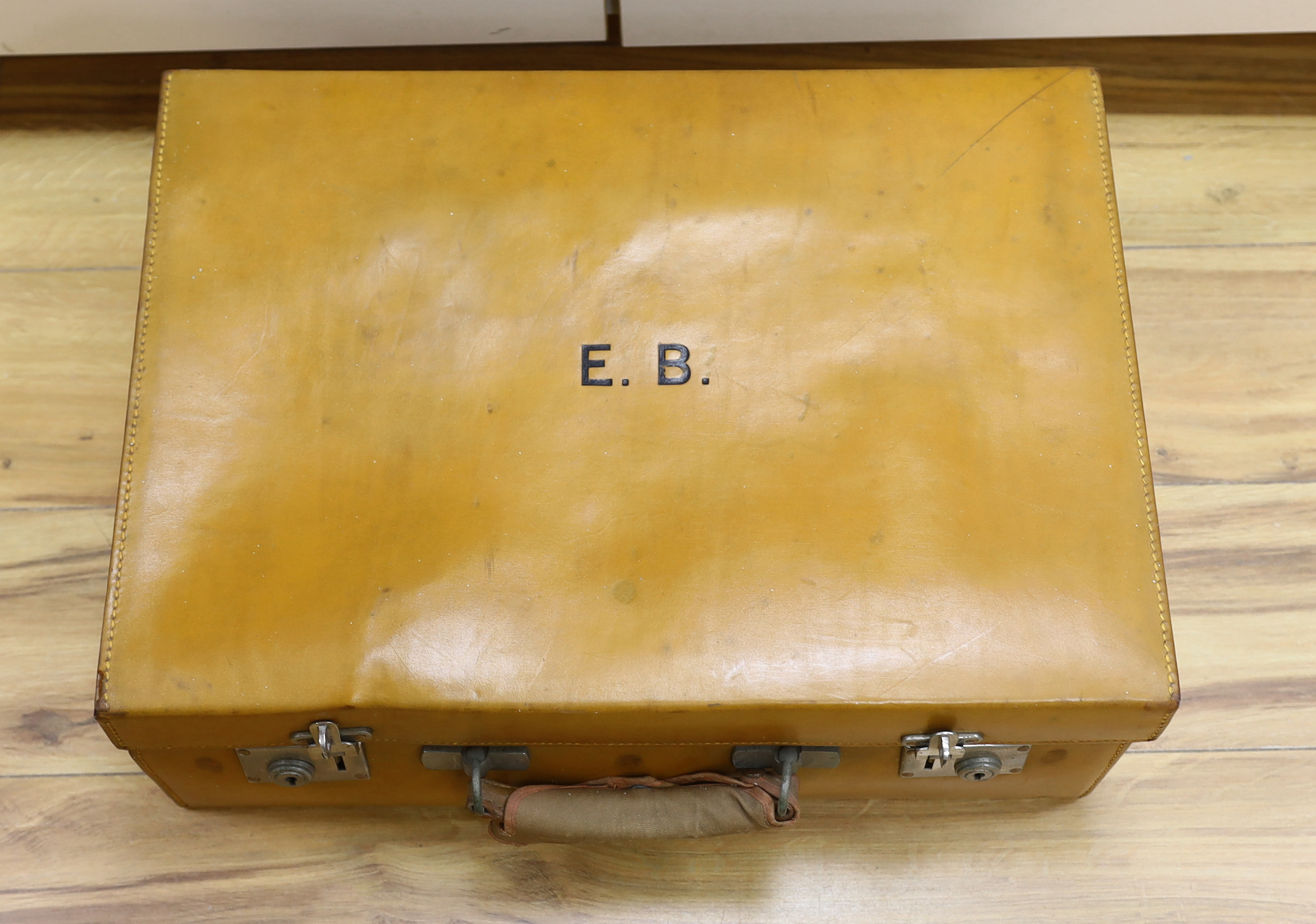 A vintage Mappin and Webb vanity case with five silver mounted bottles and shaving kit 51cm wide